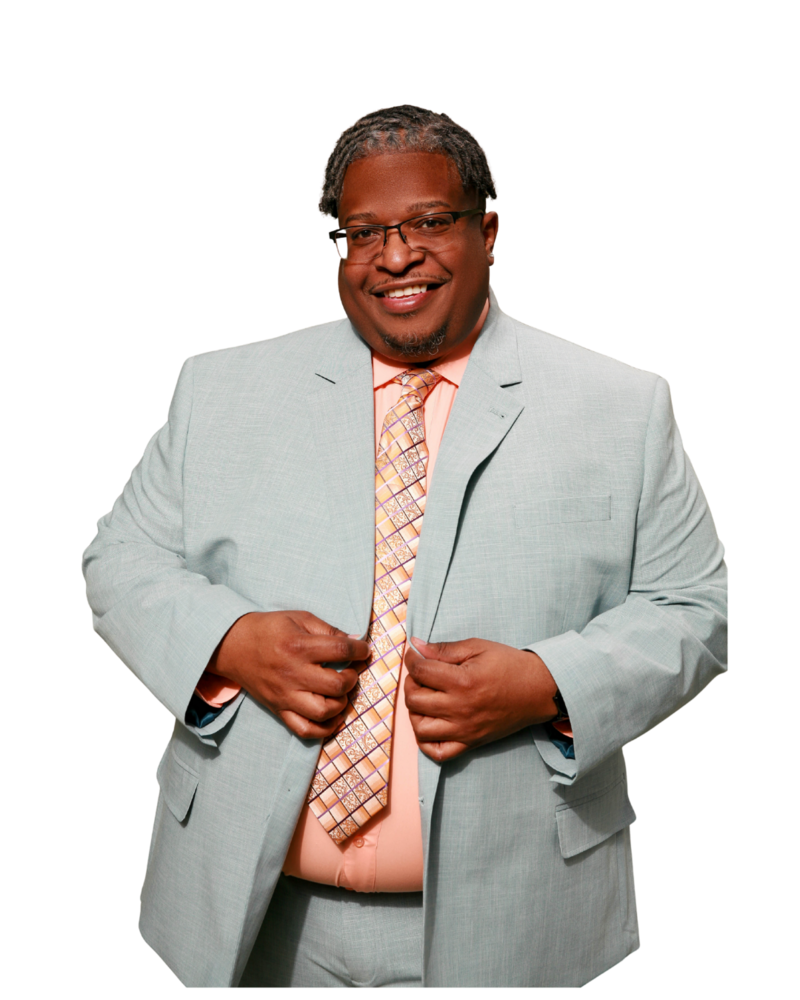 black male therapist wearing a suit smiling to the camera 