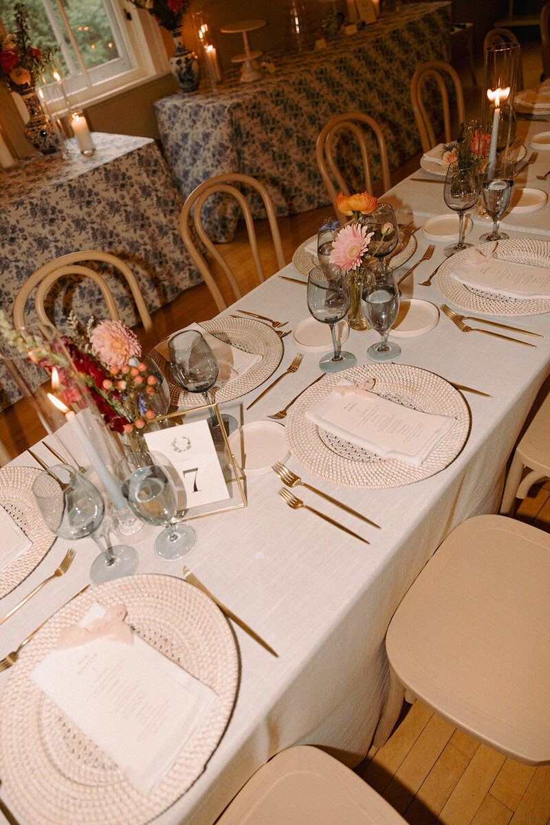 wedding tablescape with place settings and flowers at Bayfield Town Hall