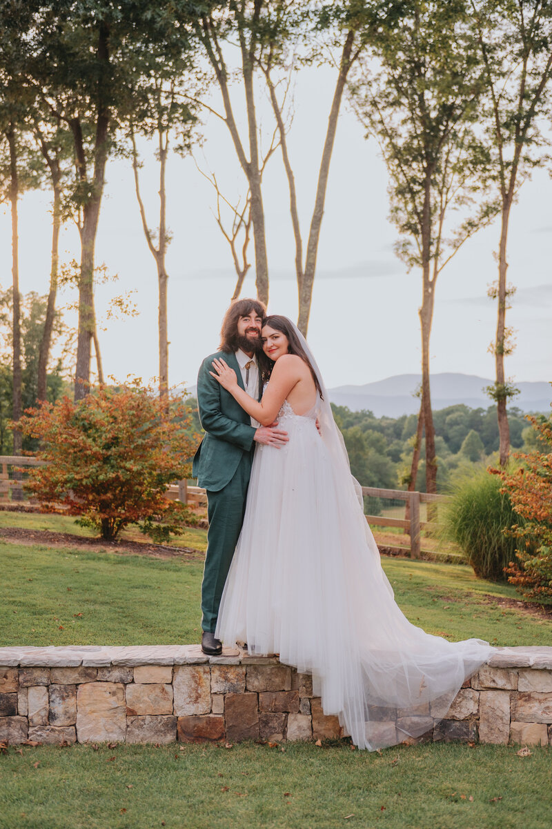 Two people lean into one another on their wedding day