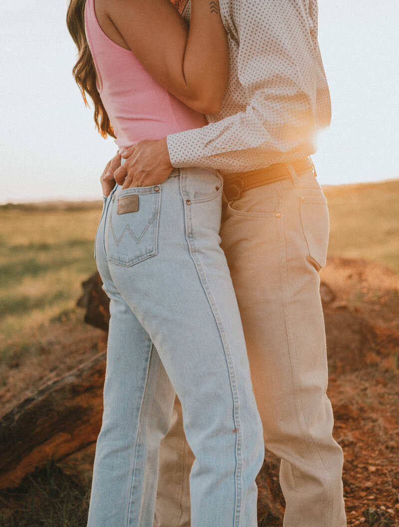 coupe embracing in field