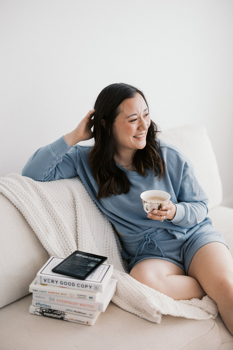 Website copywriter for small businesses sits on couch
