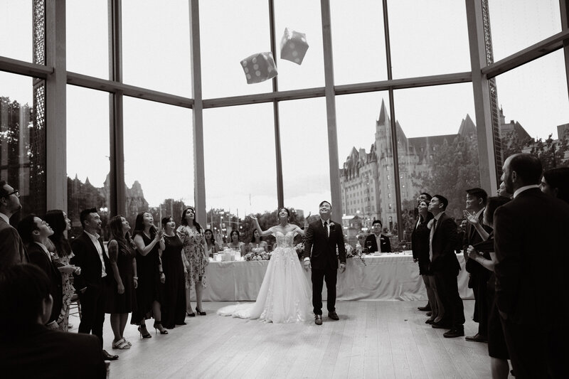 Romantic reception overlooking the rolling hills of quebec as everyone raises a glass