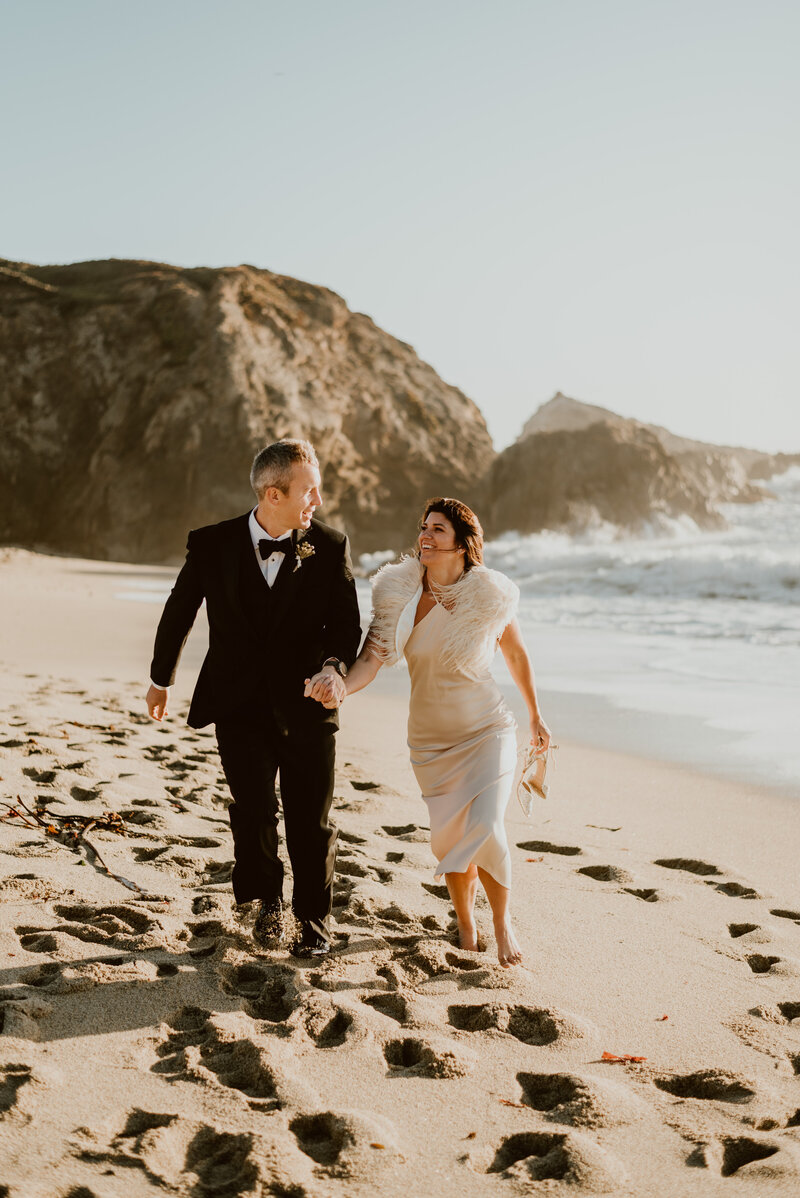Couple embracing and sharing a quiet moment on the Sonoma County coast during their all-day Northern California elopement