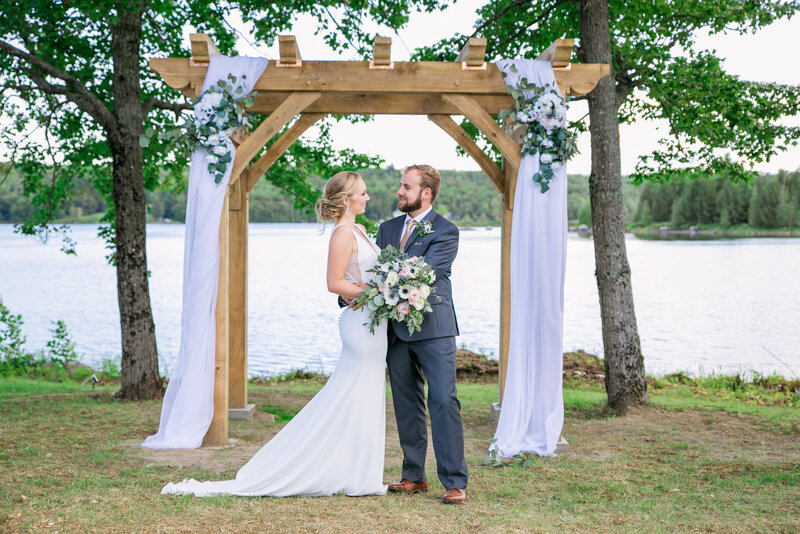 Bride and Groom standing at the altar | Klein Wedding at Grace on the Lake taken by Wedding Photographer