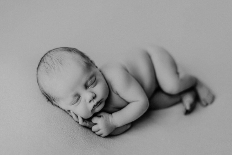 black and white photo of a newborn baby
