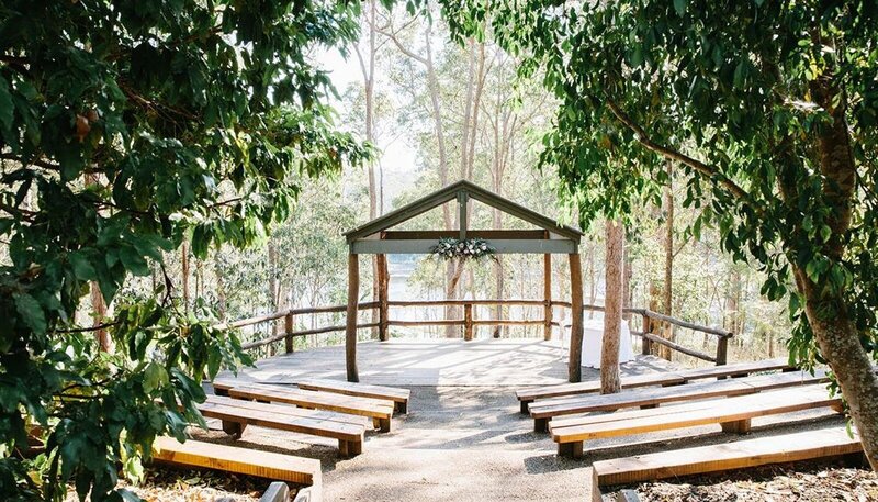 A wedding ceremony arbour and chairs set up at Walkabout Creek