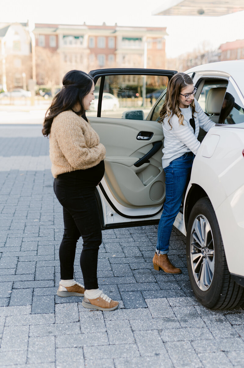Pregnant Woman learning to install car seat