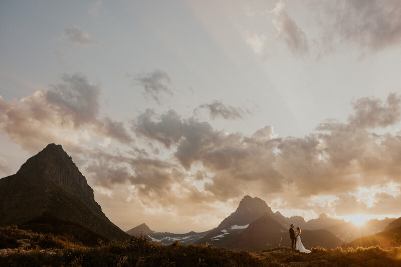 couple exchanging vows in front of aframe