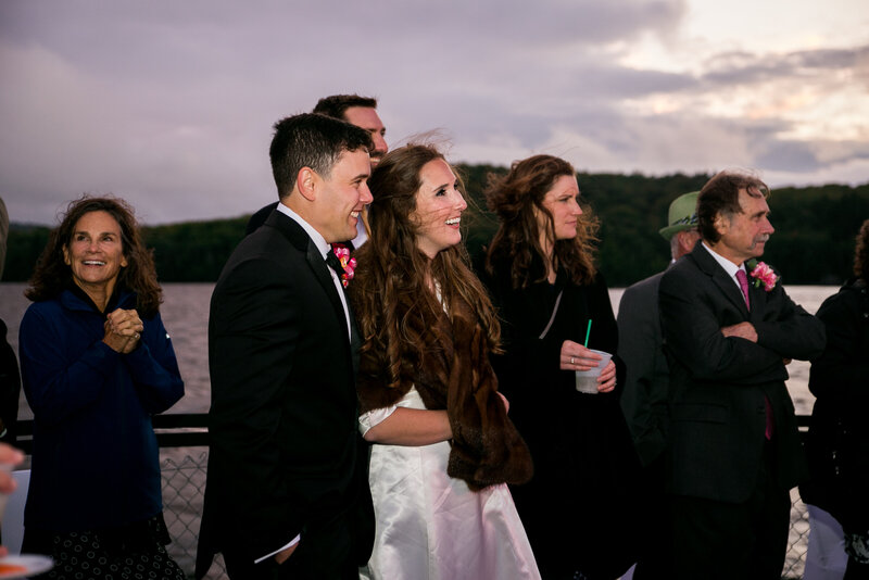 Bride and Groom standing together with wedding guests | Wedding Photography
