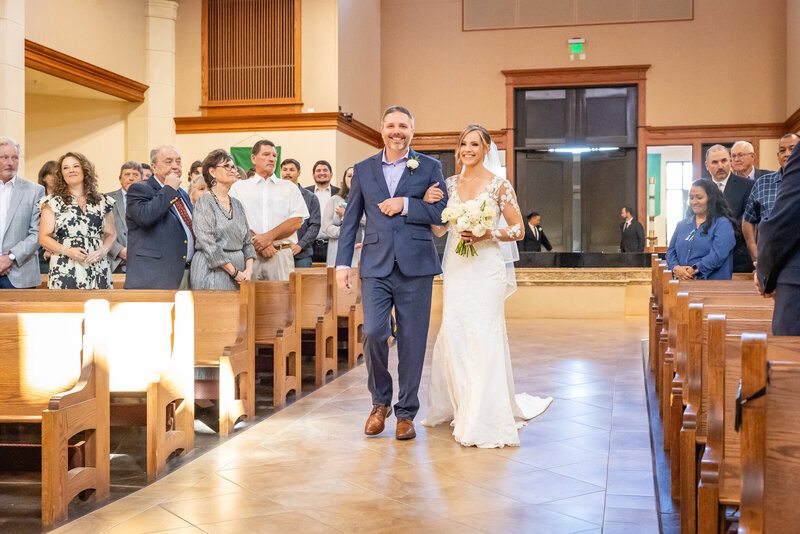 bride walks down the aisle