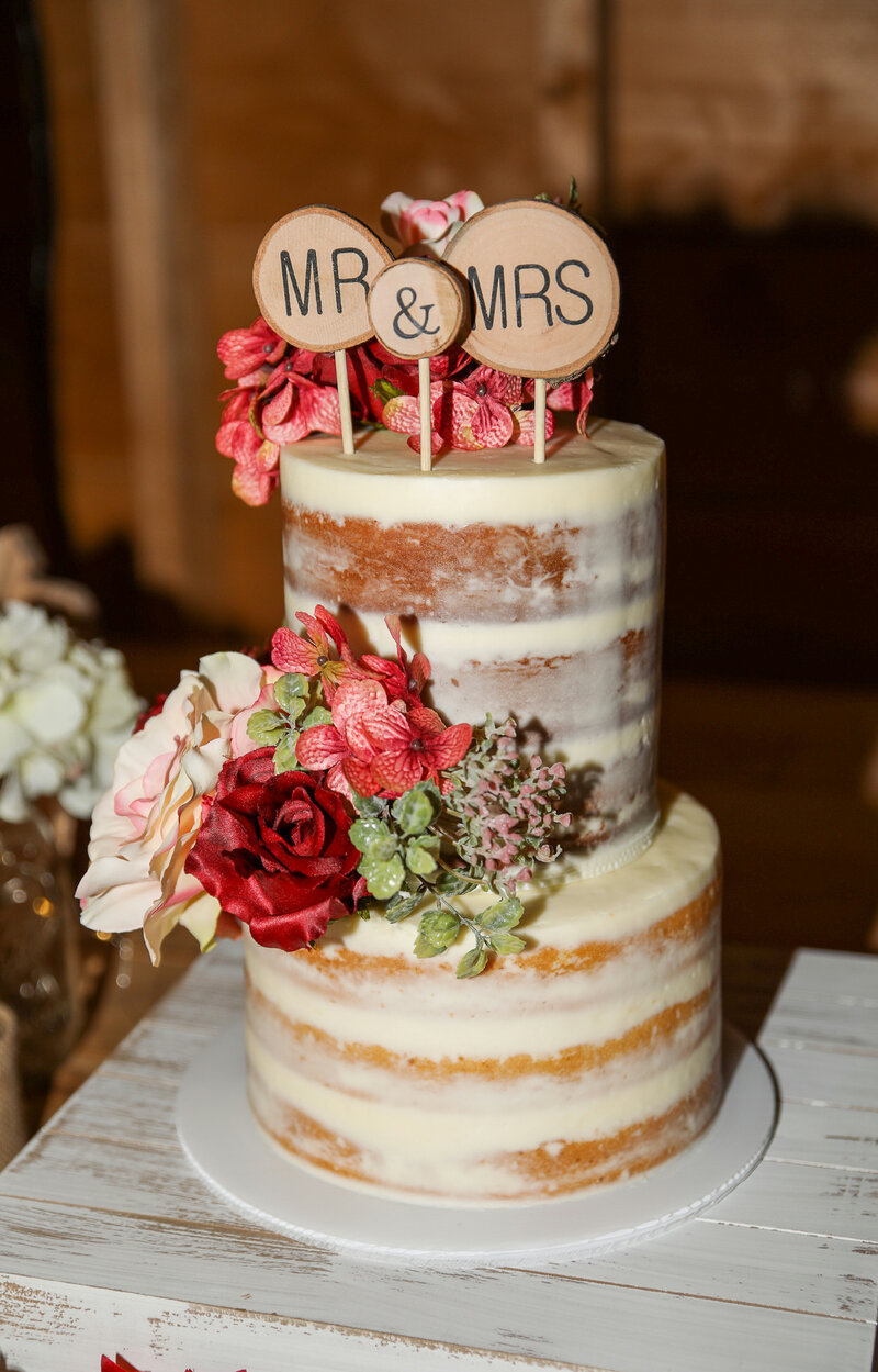 Close up of Wedding Cake with Mr & Mrs on Top | Rangeley, Maine Wedding Photography