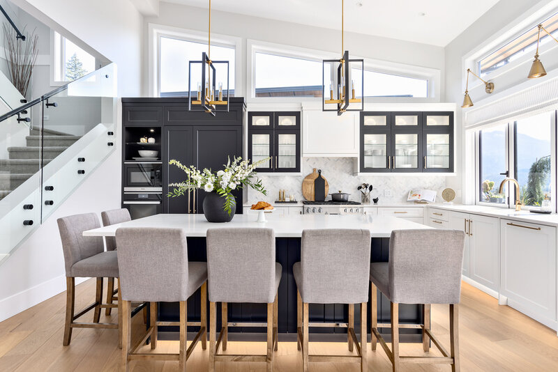 Ashley de Boer creates a transitional kitchen and living space with modern interior design elements.