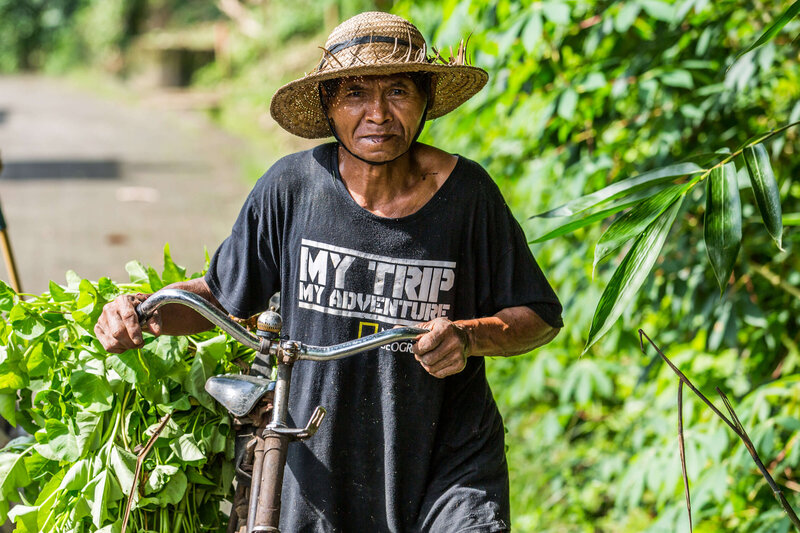 old man on bike in Bali