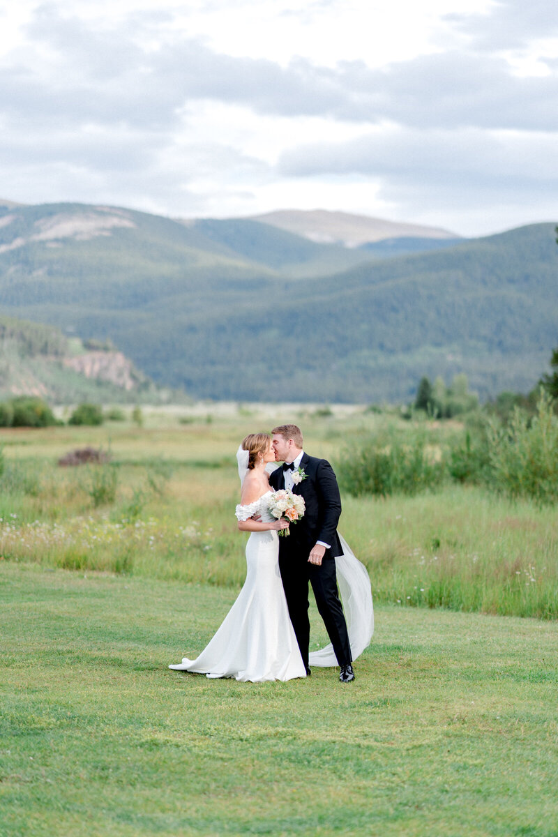 Mary Ann photographed this sweet couple under snow-capped mountains at their Devil's Thumb Ranch wedding.
