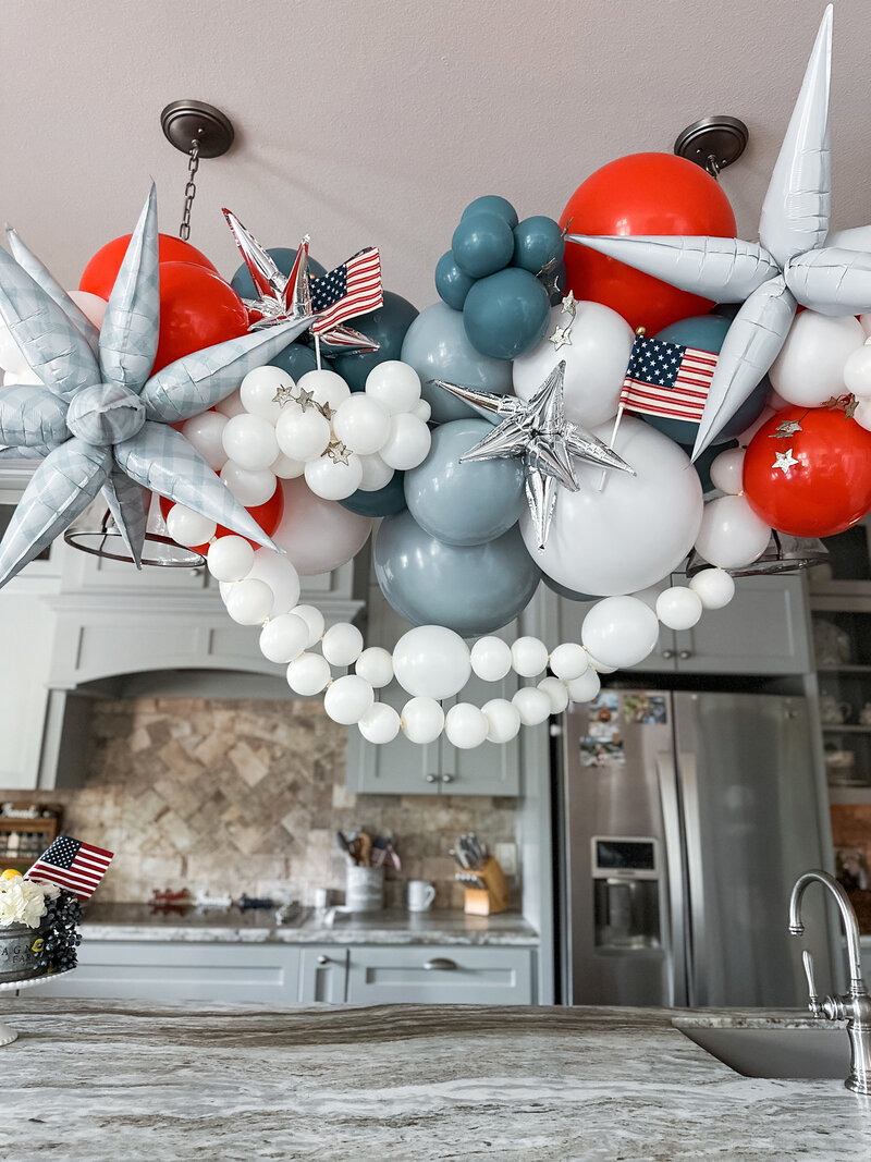 Red, white, blue balloons for a patriotic party and flag decorations.