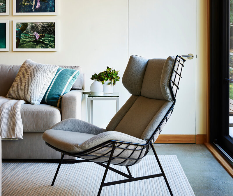 Modern interior designer Boston Hingham pool house features European furniture and simple interiors with clean lines, natural materials, and a refined modern aesthetic.