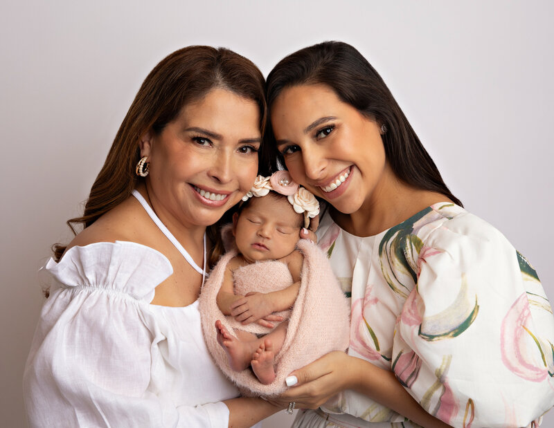 San Antonio baby newborn photography studio lifestyle newborn photographer luxury photo studio wraps outfits posing twin newborns