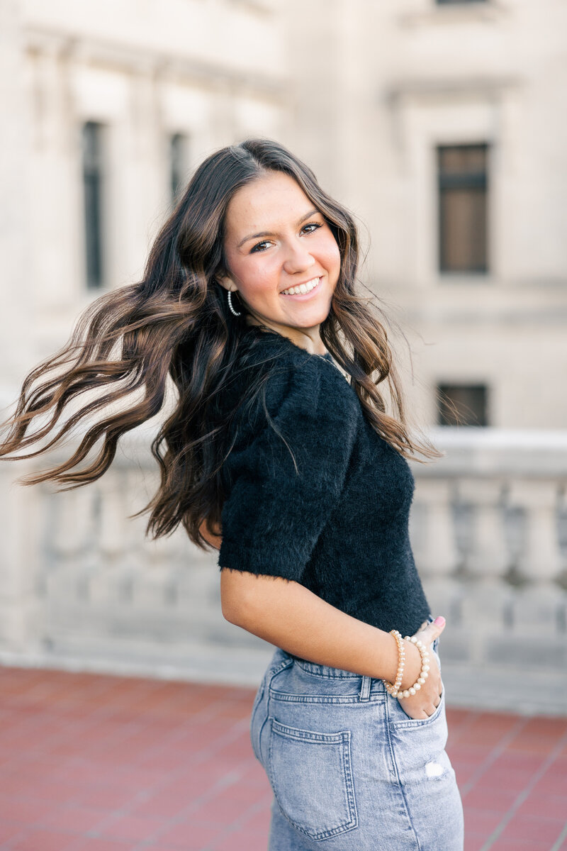 girl smiling and tossing her hair back
