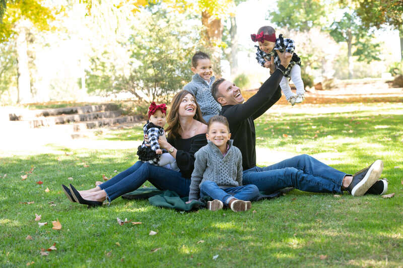 family photos with twins and two boys in the park