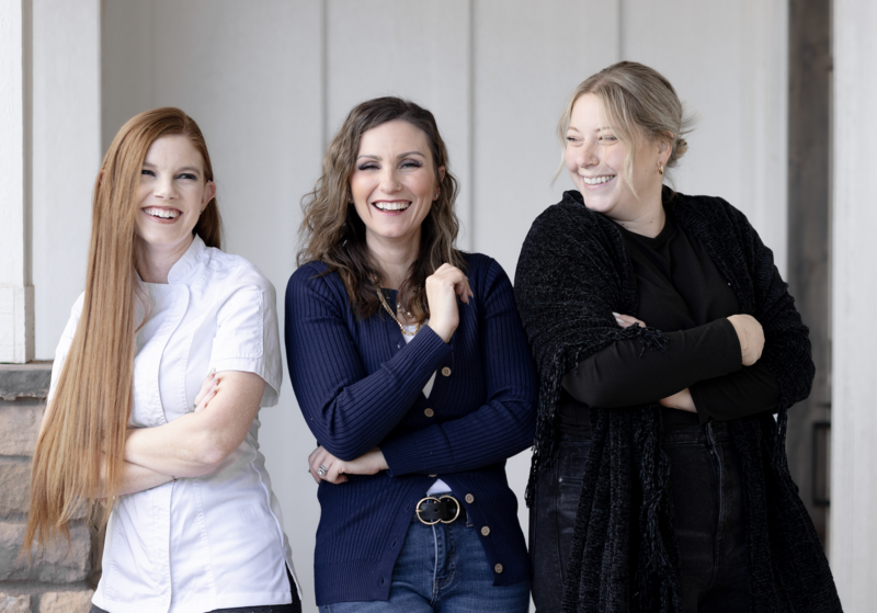 three women laughing at a joke