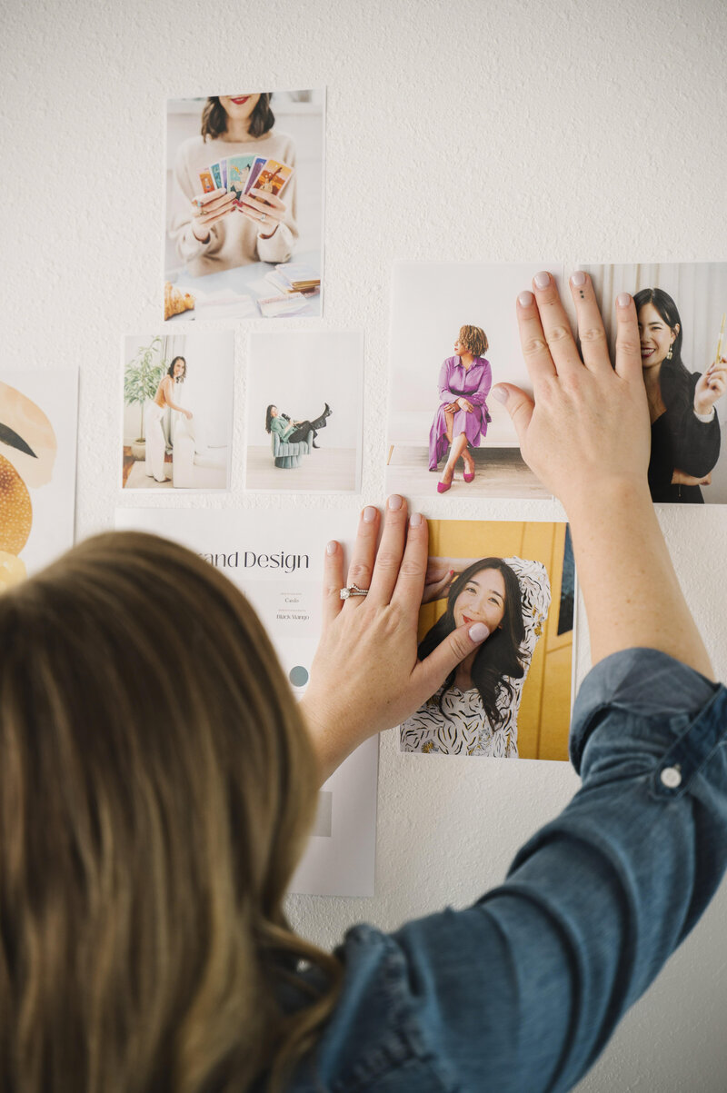 Krista Marie, a brand photographer for women, putting up brand photos of women during her brand photoshoot