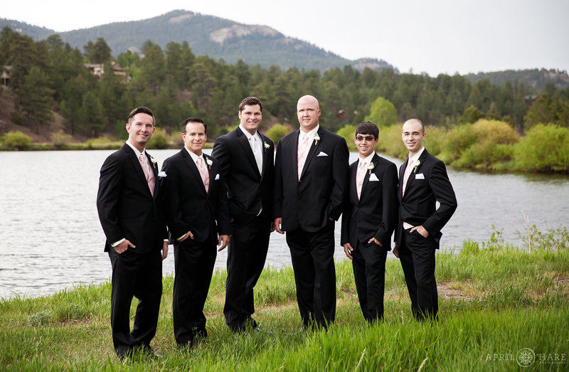 Classic groom portrait with his friends in front of lake at Mountain View Ranch