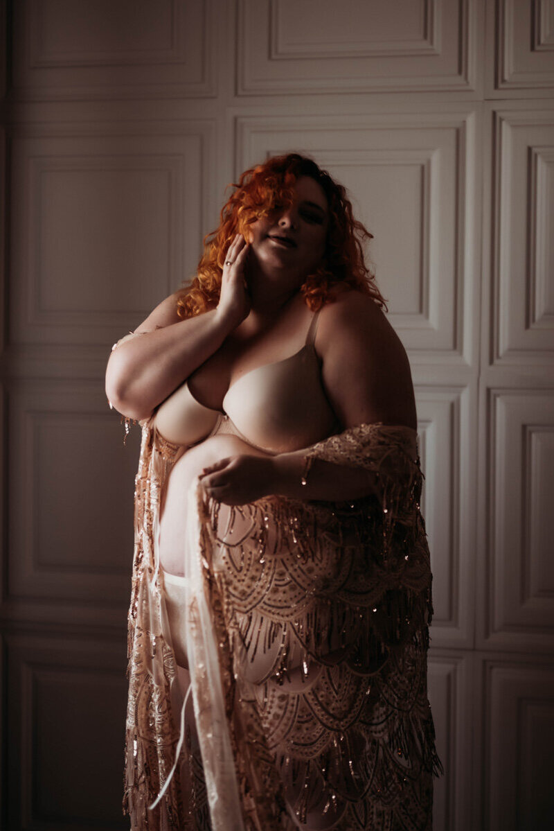 Photo of Minneapolis boudoir photographer Andrea baue in a sparkly robe