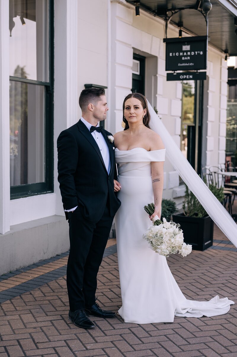 bride and groom outside eichardts luxury hotel in queenstown on their wedding day