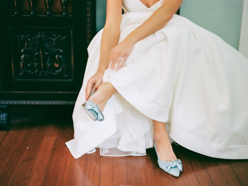 Stunning bride puts on her blue satin heels