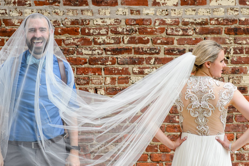 Russ Hickman under a brides veil at a wedding in philadelphia.