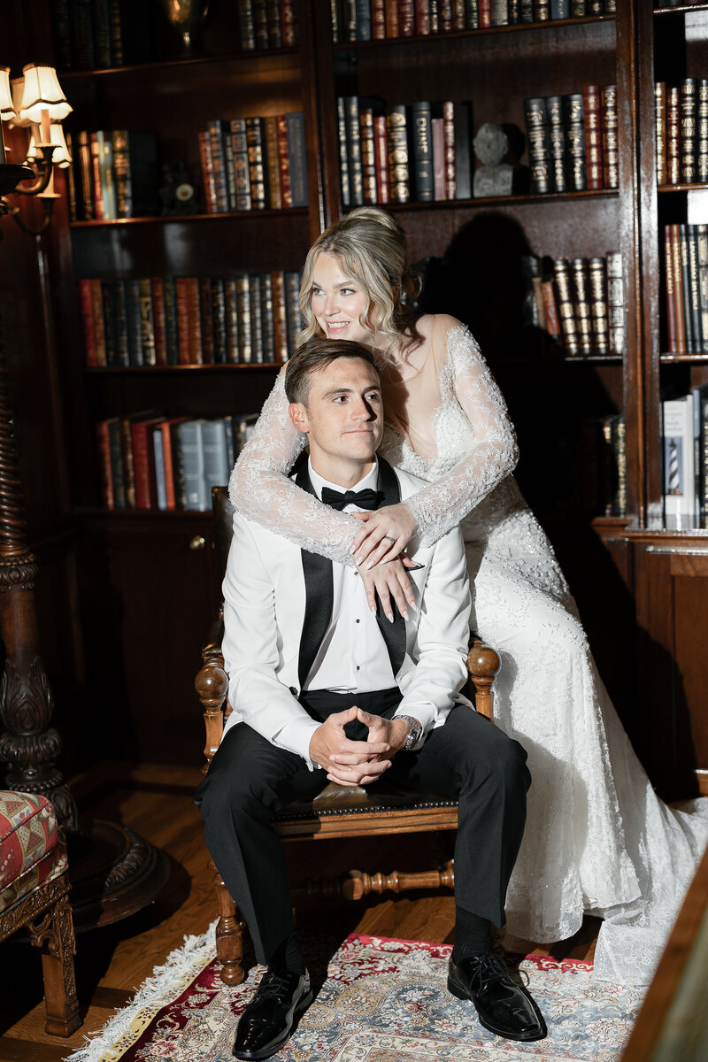 husband and wife is ornate dining room sitting on dining table and chairs