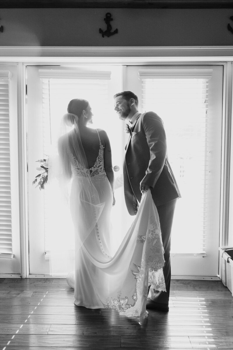 indie west photo portfolio image of bride and groom next to window on wedding day