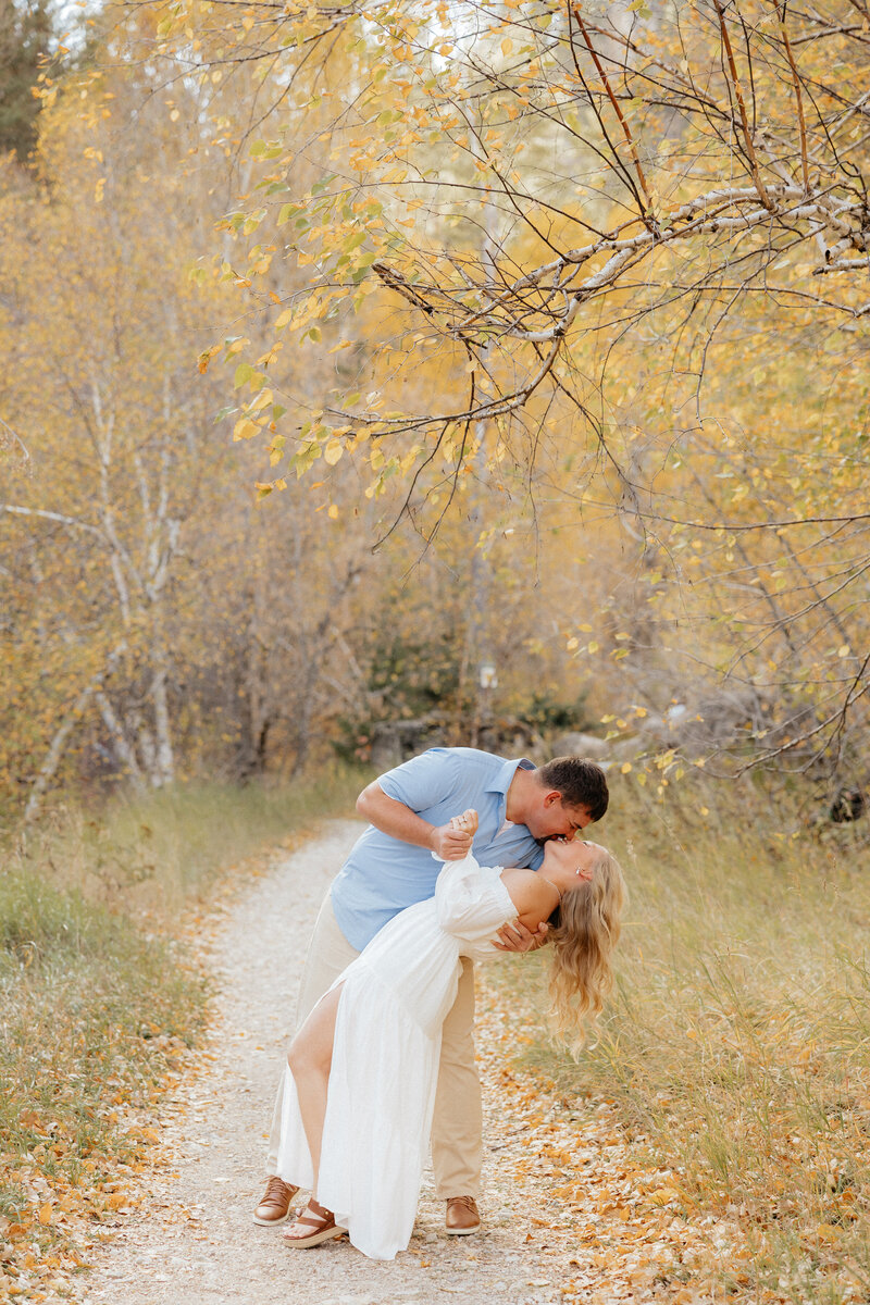 A man twirling his fiance.