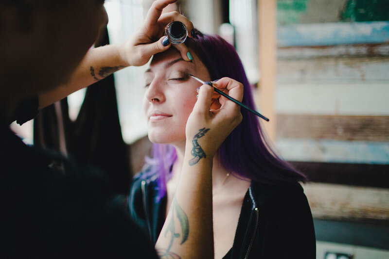 Behind the scenes BTS Purple hair edgy model wing liner tattoos makeup artist