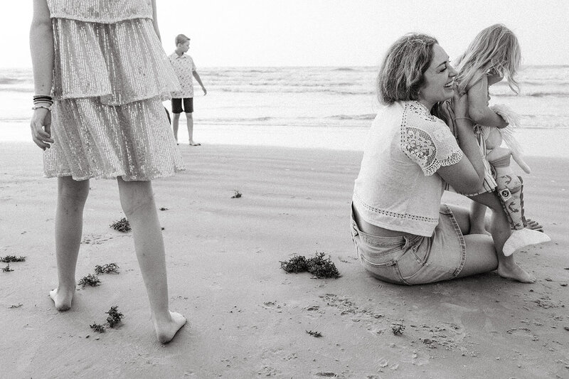 Black and white family portrait on the beach, photographed by San Antonio family photographer Sara James.