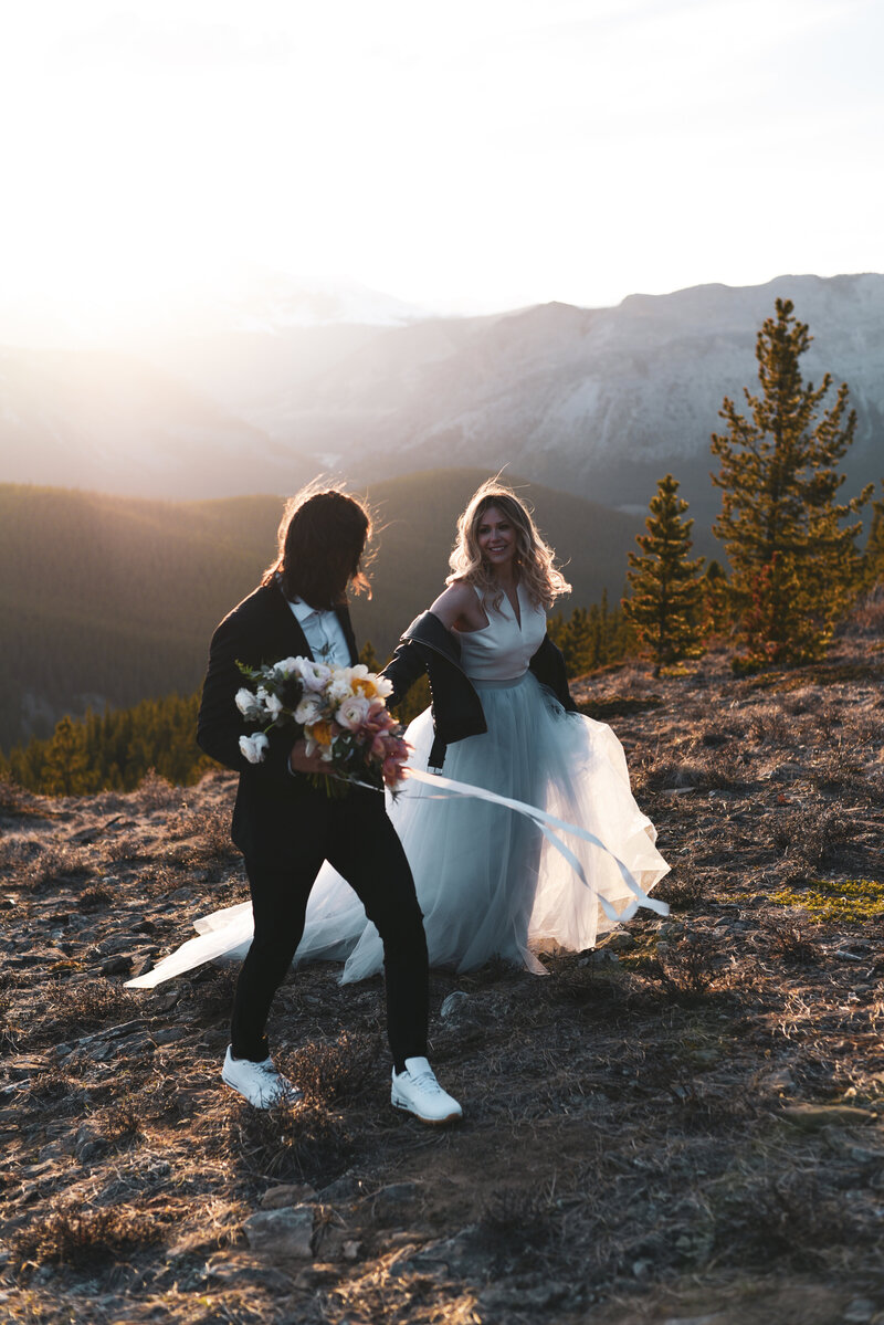 Bride and groom on mountain wedding elopement with stunning views