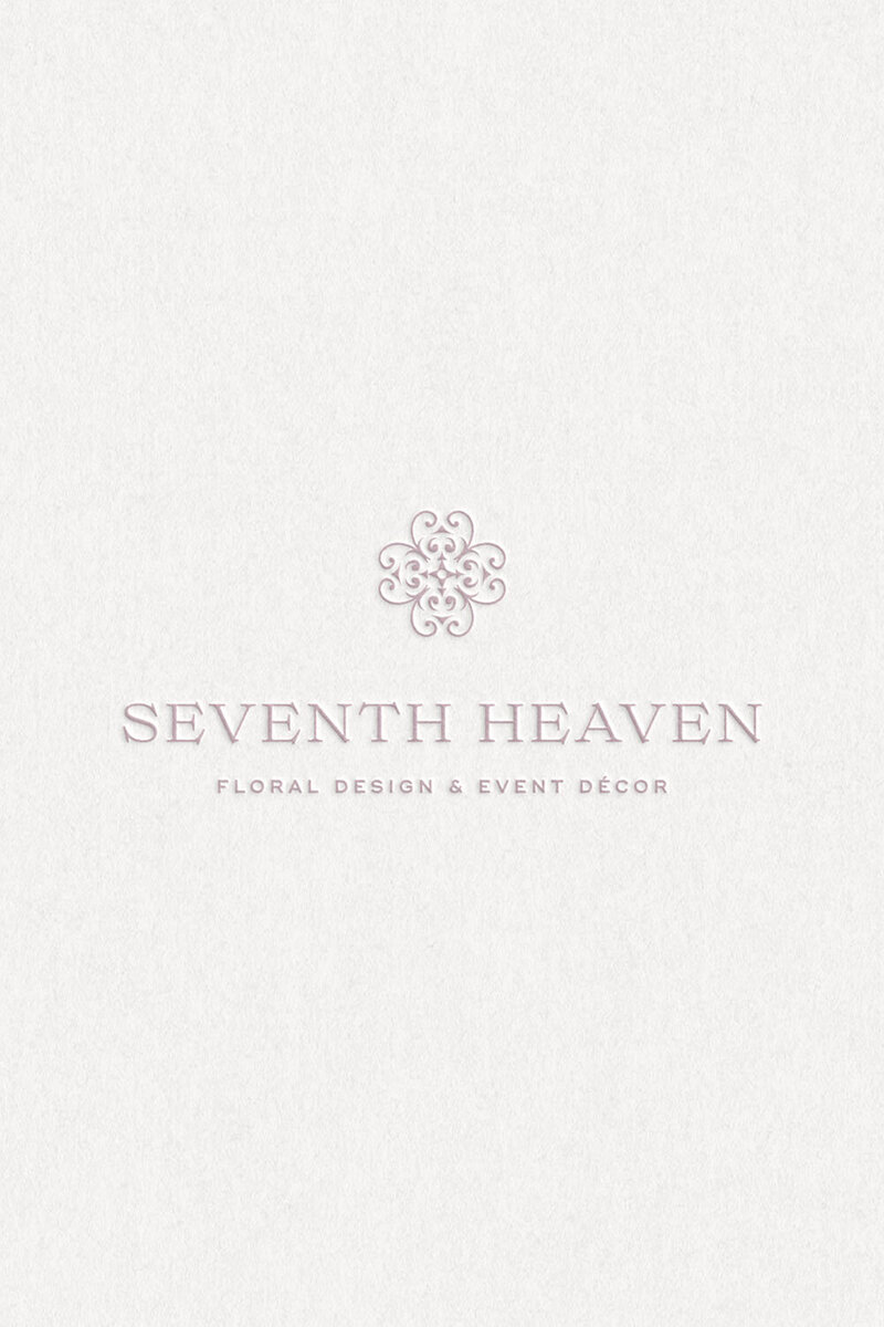 Mauve logo design printed on cream textured paper for luxury floral brand Seventh Heaven Events