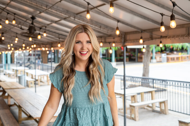 woman smiling standing outside