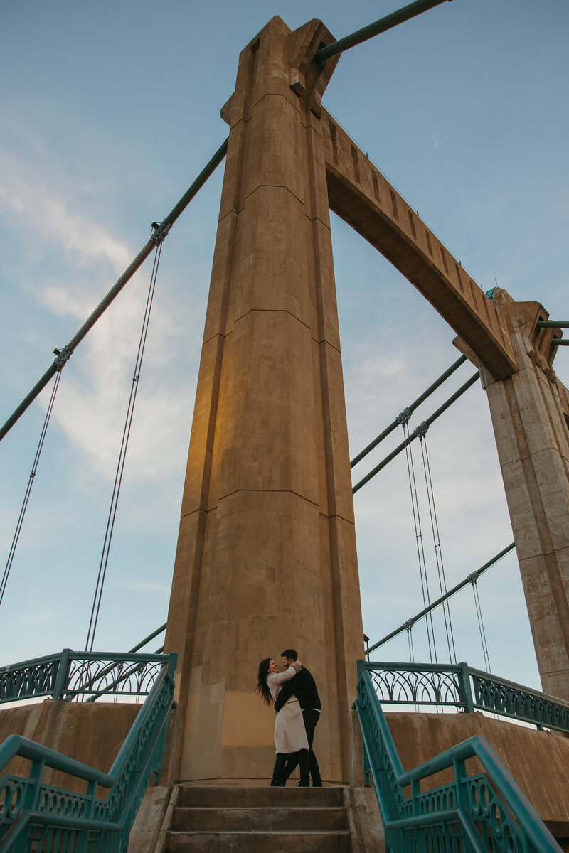 couple dances on bridge