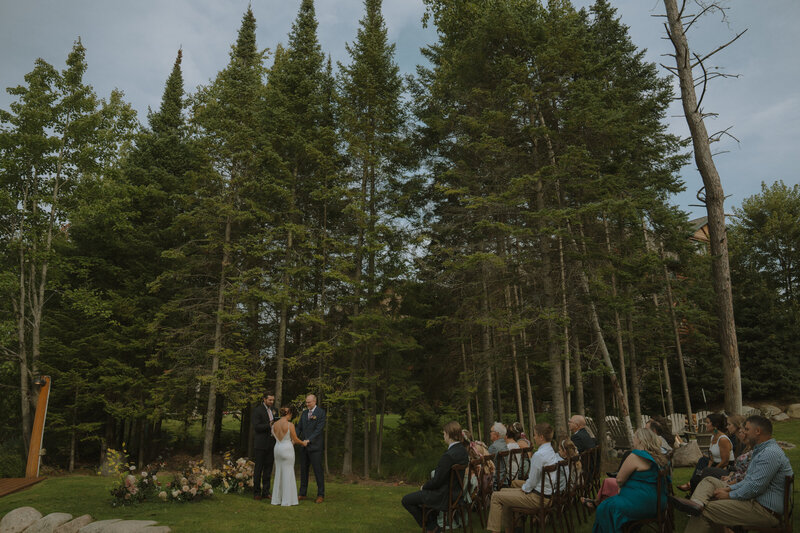 Man and woman smiling at each other during wedding