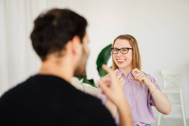 Stephanie works with a student on pronouncing the TH sounds in English.