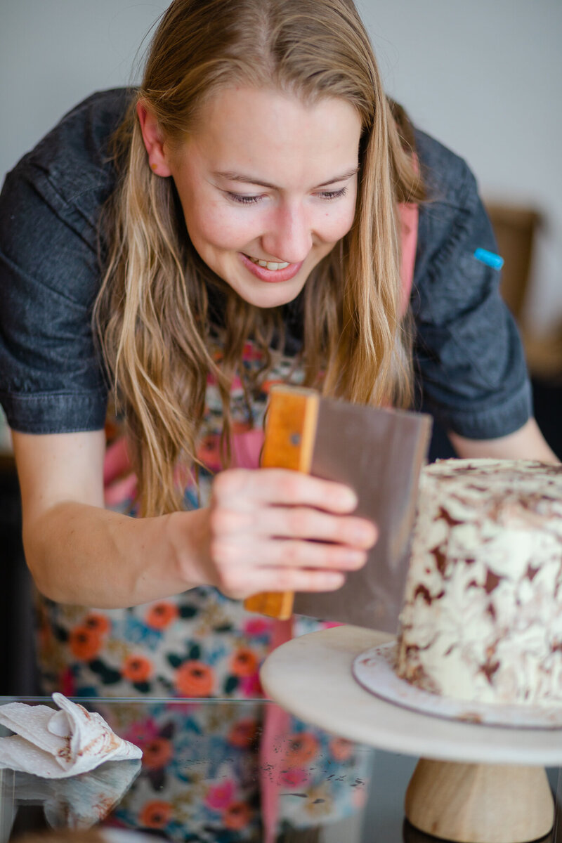 Baker working on a cake