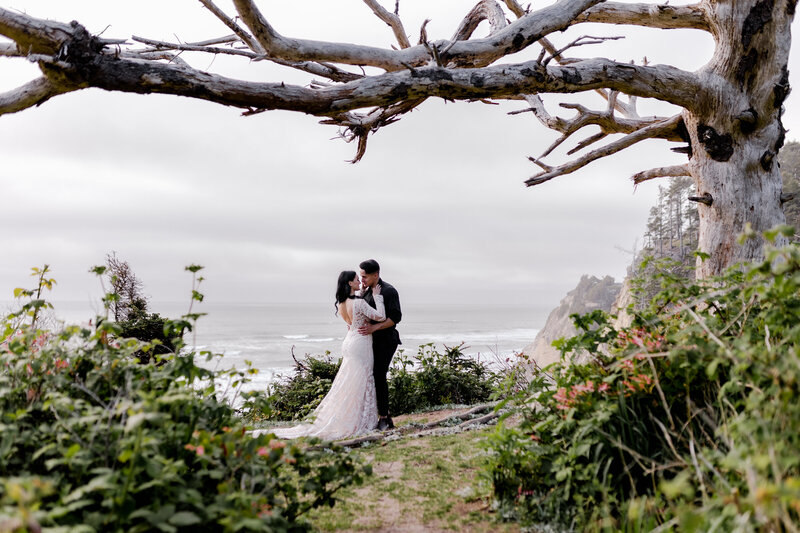 photo of couple taken from afar in nature Oregon Coast Elopement and Wedding Photographer