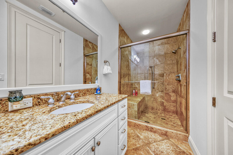 large bathroom with vanity and walk in shower