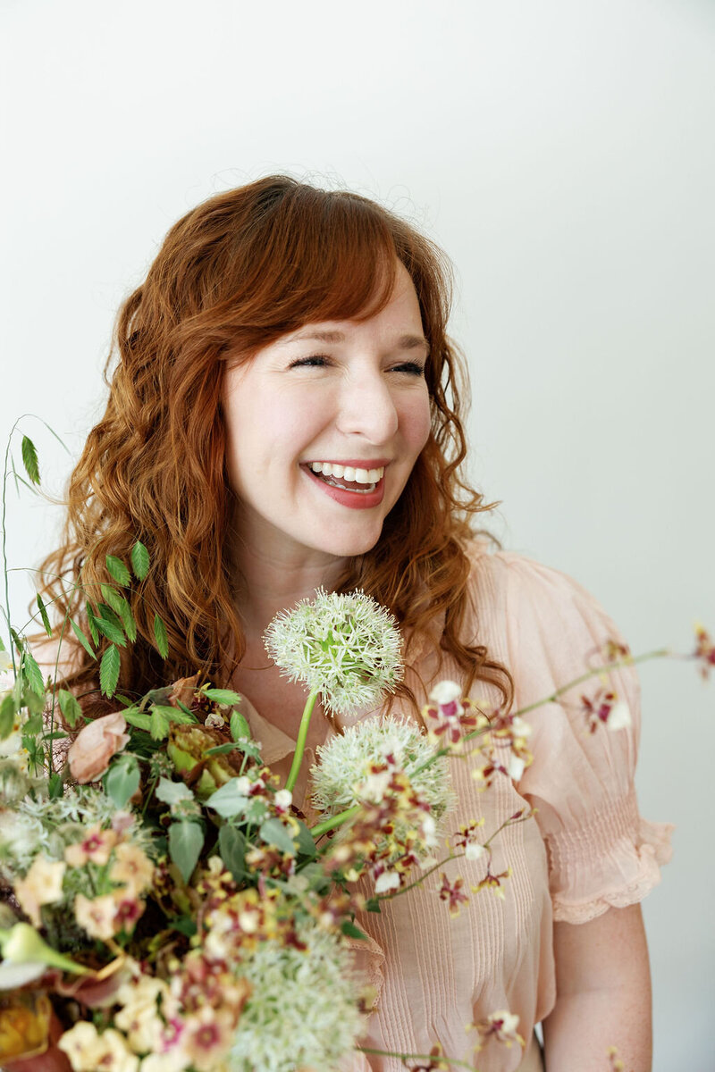 Mary Love and Mackenzie of Rosemary and Finch wedding floral designers, florists, in Nashville, TN. Specialize in large scale weddings, installation, travel weddings, beach, mountain. Floral hues of purple, magenta, and natural greenery.