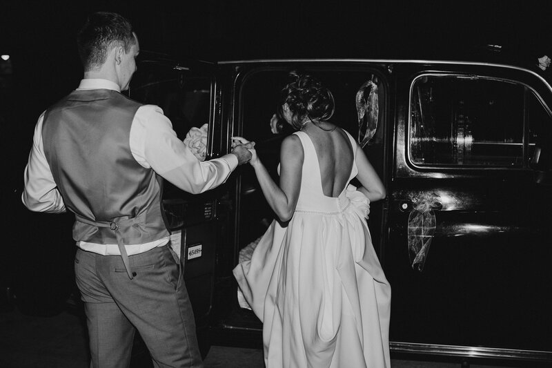 Couple gets into classic car after wedding