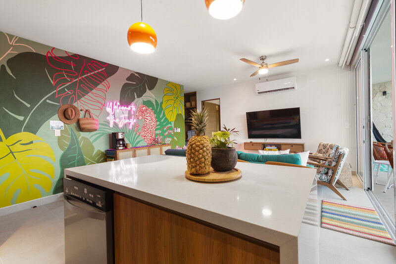 View of Living Island, Living Room & Mural at Dusk