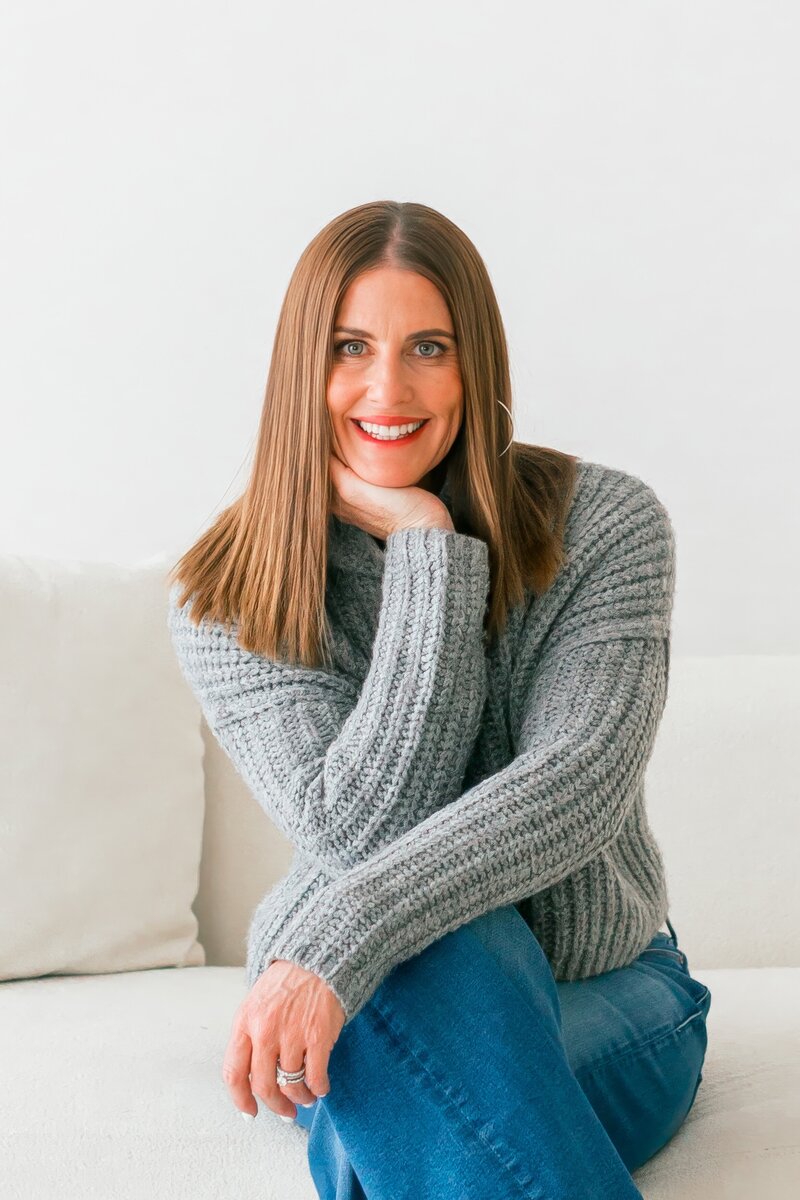 danielle muccillo sitting down posing for the camera at a studio session