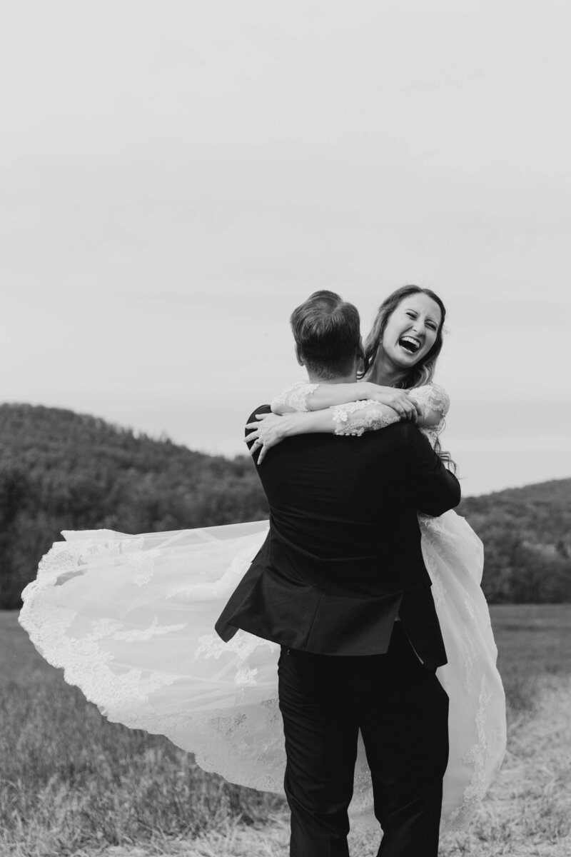 catskill-mountain-wedding-bride-and-groom-laughing-and-spinning-philadelphia-wedding-photographer