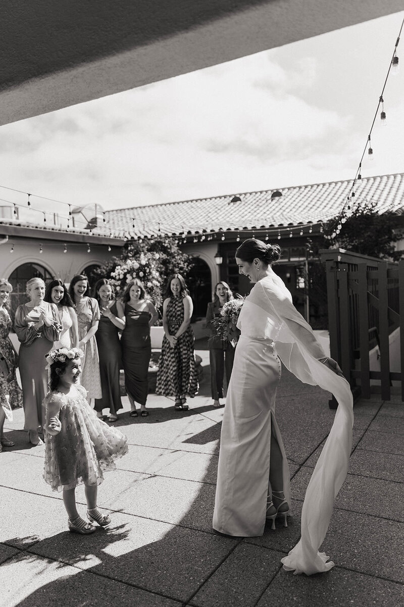 black and white image bride and groom embracing